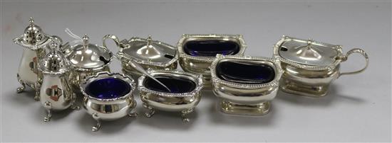 Three assorted 20th century silver three piece silver condiment sets.